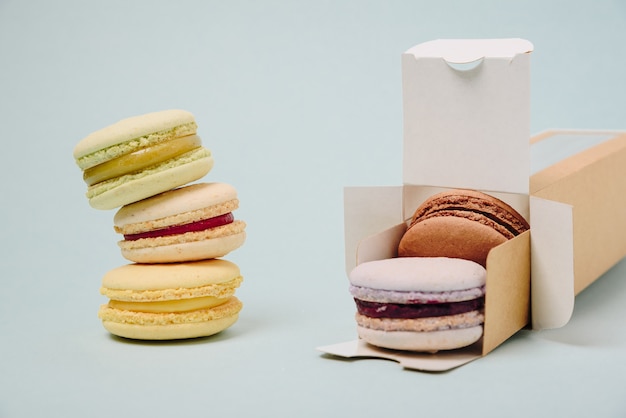 Several colorful macaroon cakes in box