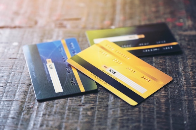 Several credit cards on wooden table