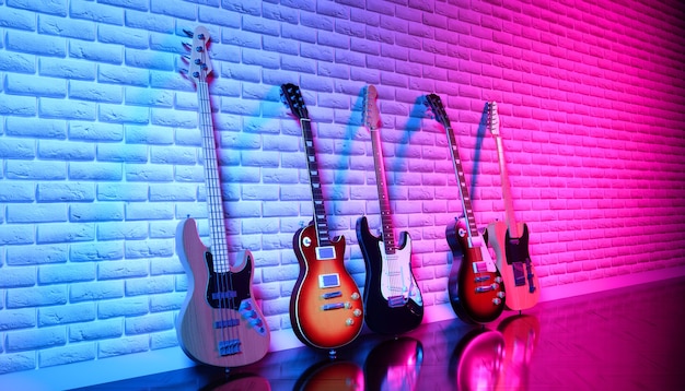 Several electric guitars against a brick wall in neon light, 3d illustration