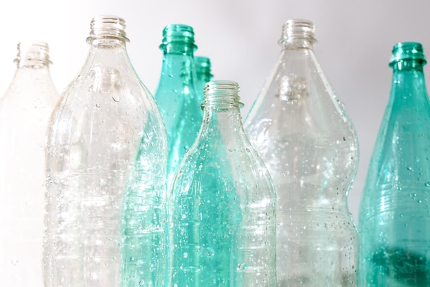 Several empty plastic bottles with water drops ecology recycling