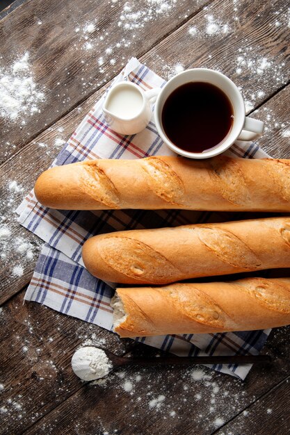 Several french baguettes with coffee and milk