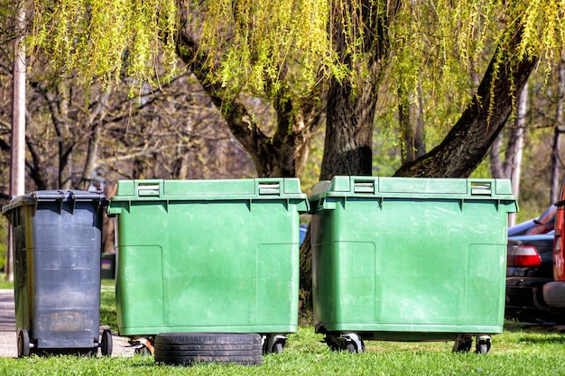 Several garbage cans in the park