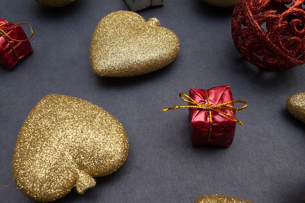 Several golden christmas ornaments on blue background