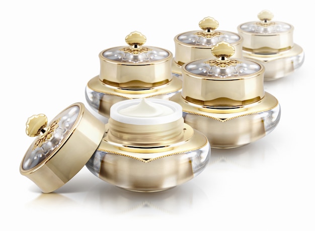 Several golden crown cosmetic jars