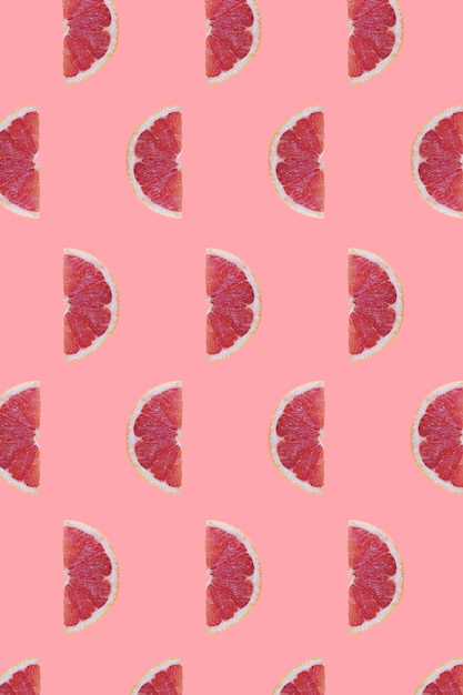 Several grapefruits against pink color background