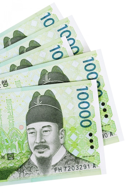 Several Korean 10,000 Won currency bills fully isolated against white 