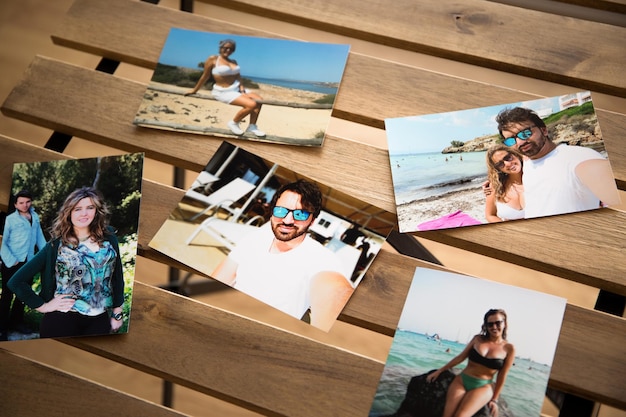 Photo several photos of a couple on the beaches of mallorca. on a wooden table with holes in it.