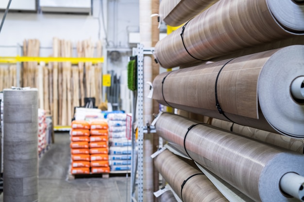 Several rolls of linoleum and other home renovation goods