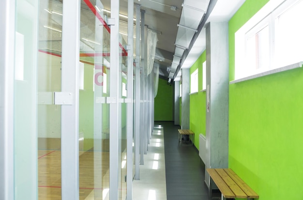 Several squash courts lined up in a tennis club Horizontal photo