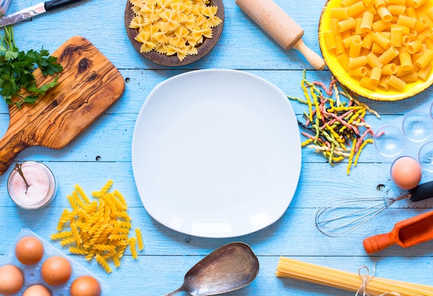  Several types of pasta with vegetables,  . Top view