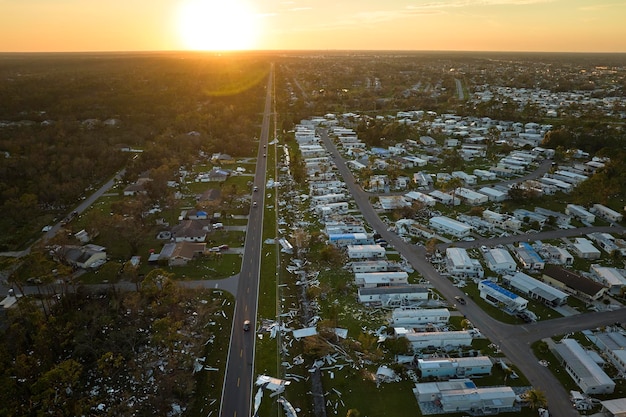 Severely damaged by hurricane ian houses in florida mobile home\
residential area consequences of natural disaster