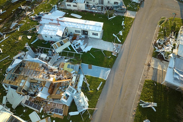 Severely damaged by hurricane Ian houses in Florida mobile home residential area Consequences of natural disaster