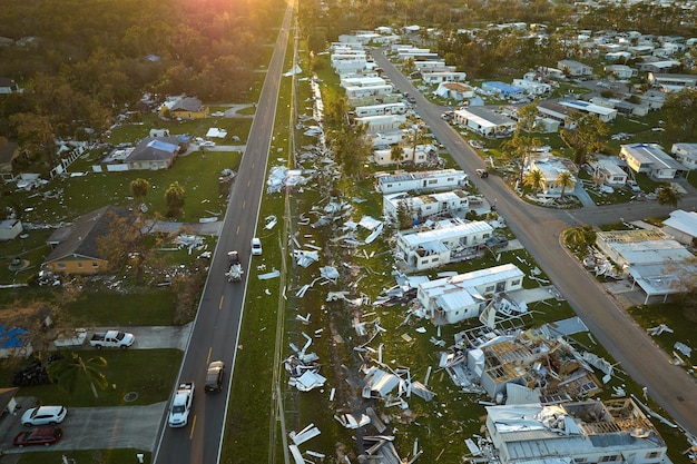 Severely damaged houses after hurricane Ian in Florida mobile home residential area Consequences of natural disaster