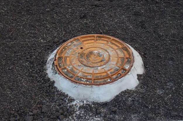 Sewer manhole in the ground