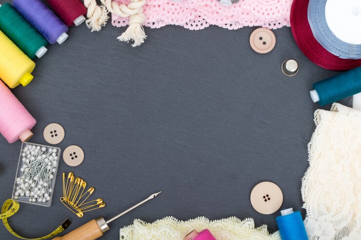 Photo sewing accessories on black table