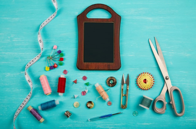 Photo sewing accessories on a blue surface