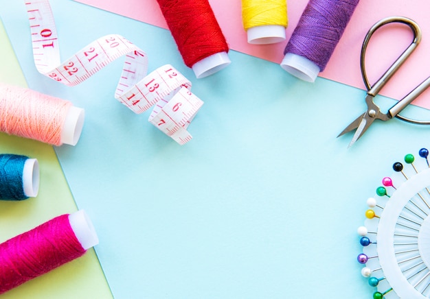 Sewing accessories isolated on blue