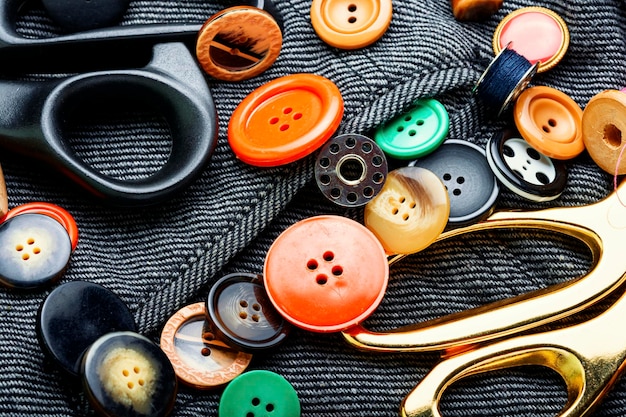 Premium Photo  Sewing kit of threads, buttons and fabric.accessories for  sewing and needlework