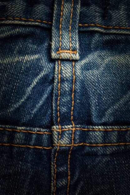 Sewing line of vintage blue jeans.