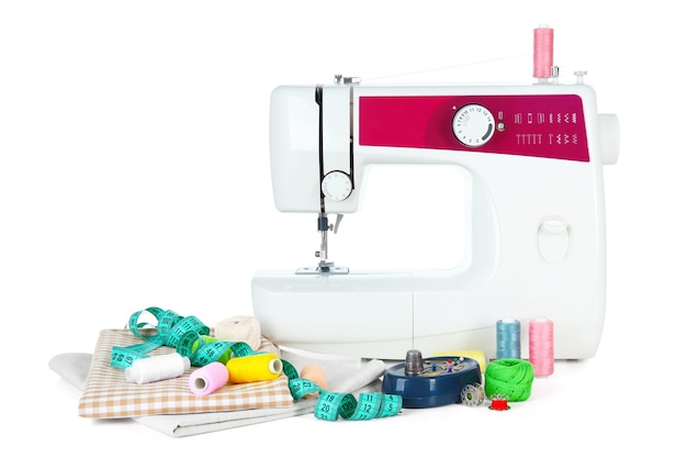 Sewing machine, fabric and threads on white