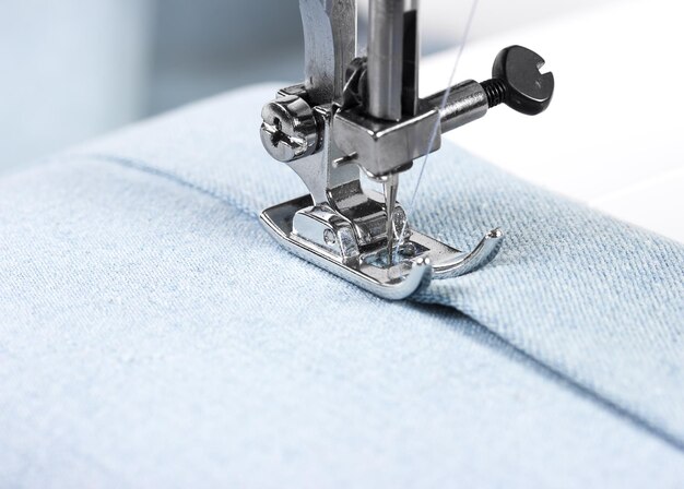 Sewing machine working part with blue cloth