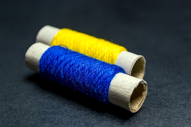 Sewing multi-colored threads on a black