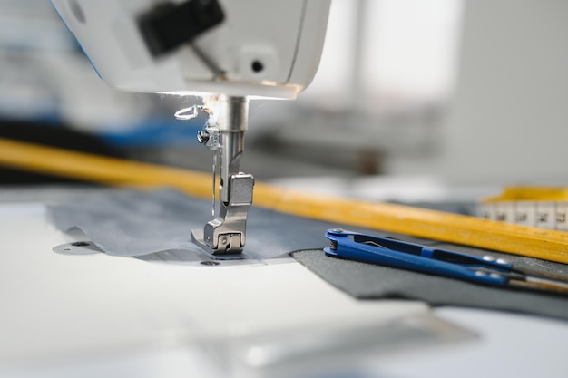 Sewing supplies on the table next to the sewing machine