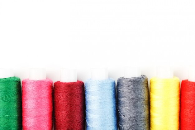 Sewing threads of different colors on reels