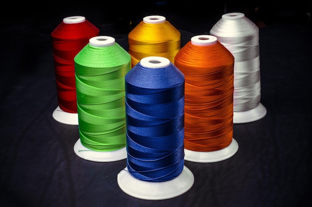 Sewing threads multicolored on a black background