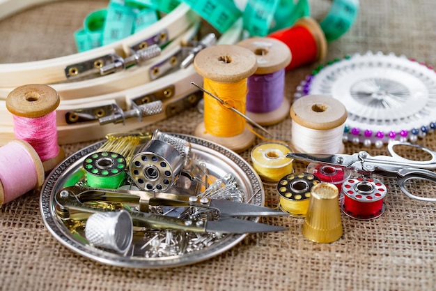 Premium Photo | Sewing threads and needles