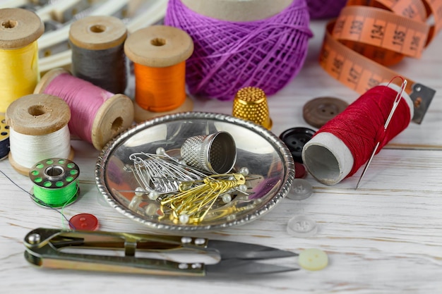 Premium Photo | Sewing threads and needles