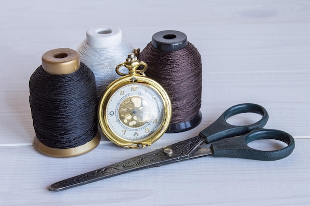 Sewing tools on a wooden background