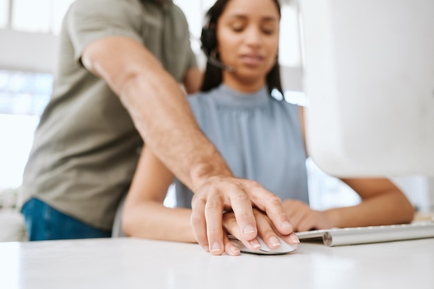 Sexual harassment or abuse by a business man of a female employee by putting his hand on hers Unhappy and scared female coworker feeling uncomfortable due to inappropriate touching in the office