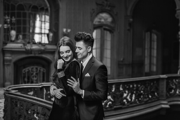 Sexual passionate couple in elegant evening dresses Luxurious interior Fashion shot