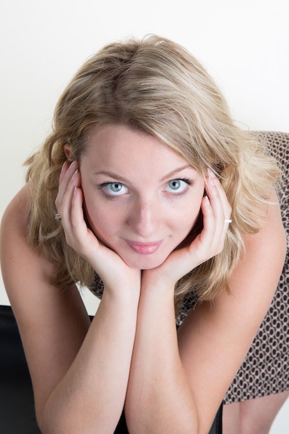 Sexy blond woman posing in front of camera