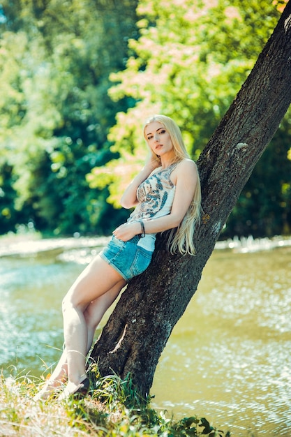 Sexy blonde in denim shorts with long legsPortrait of an european blonde girls