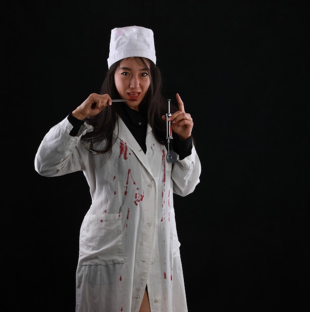 sexy bloody nurse on black background