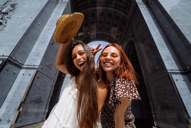 Sexy carefree women posing on street background