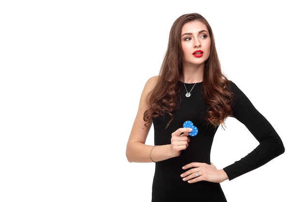 Sexy curly hair brunette posing with chips in her hands, poker concept isolation on white background