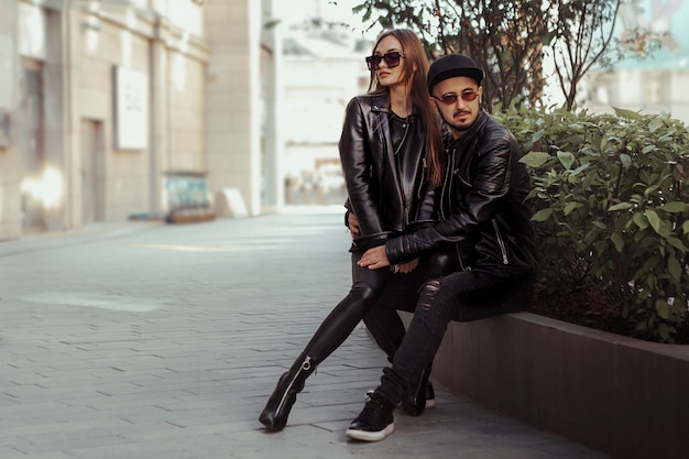 Sexy fashionable coupleposing in the street