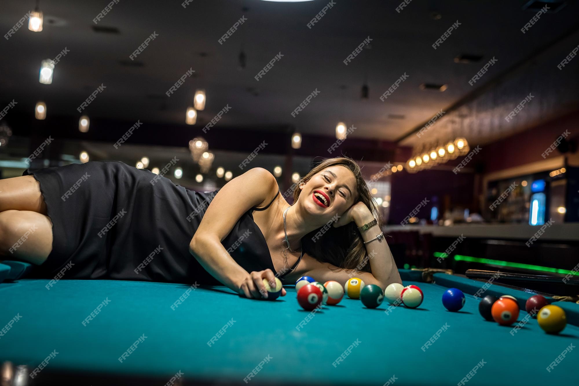 Premium Photo Sexy Female Pool Player Wear Black Dress Lying On Billiard Table