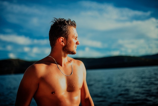 Sexy Fit man posing at the beach