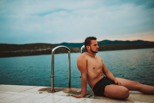 Sexy Fit man posing at the beach