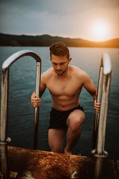 Sexy Fit man posing at the beach