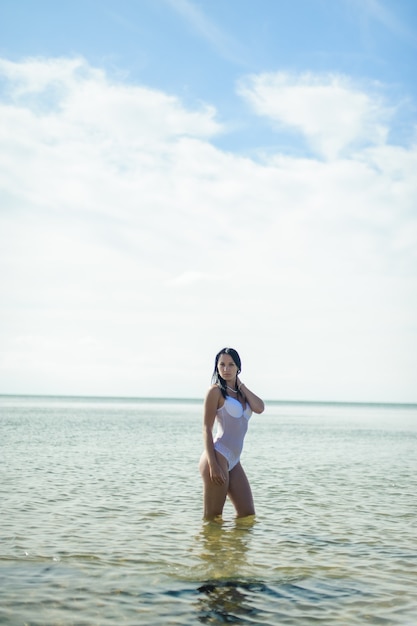 Sexy girl rests on the beach.