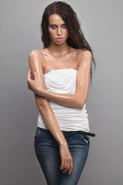 Sexy girl. Wet beauty portrait studio.