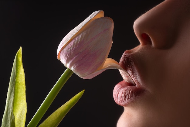 Sexy lesbian foreplay lip with tulip flower blowjob and kiss sexy female mouth and spring flower ora...