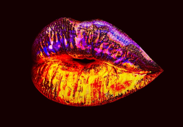 Sexy lip Neon lipstick gold mouth Isolated on black