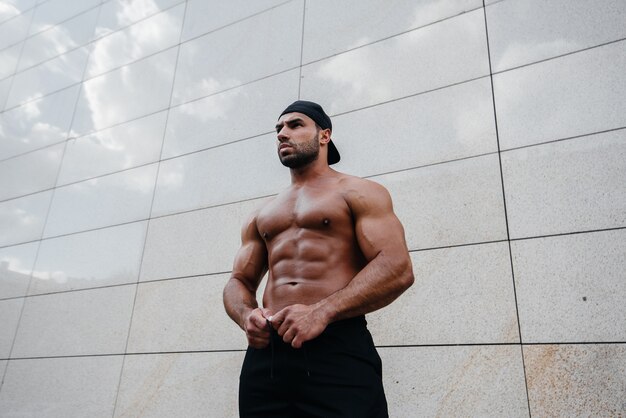 Sexy man posing topless in the hot sun. Fitness. Lifestyle