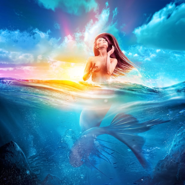 Sexy mermaid emerges out from sea at sunset conept art